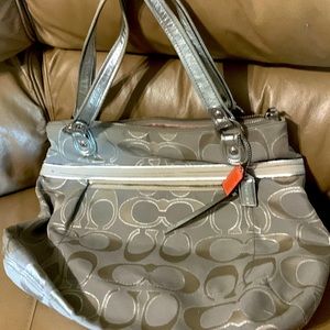Coach bag. great shape silver. pink silk inside